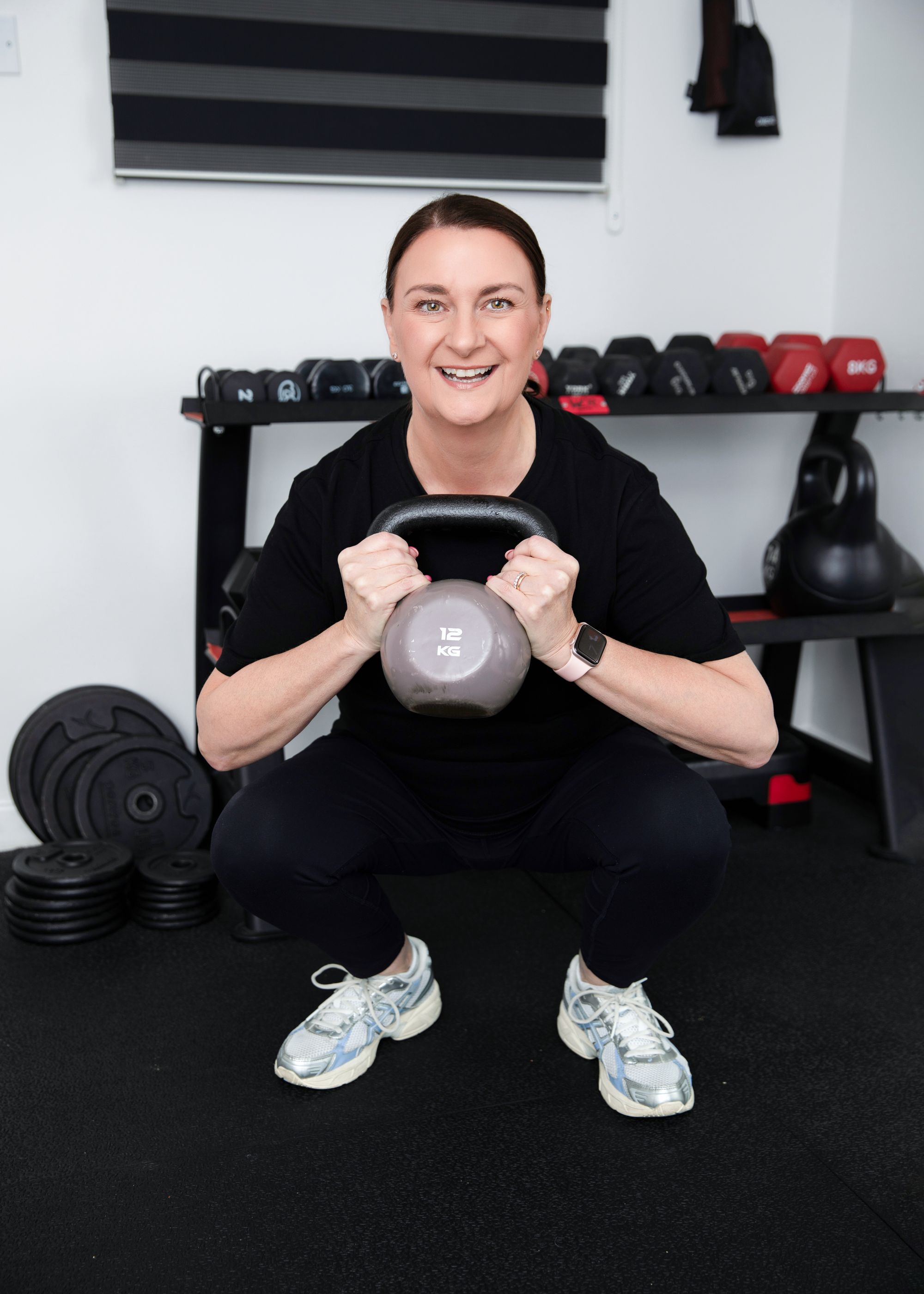 Suzy Newson doing a kettlebell squat, a beginner's guide to body toning